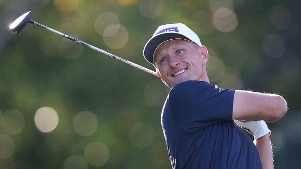 Adrian Meronk watches a drive at the 2023 BMW PGA Championship at Wentworth Golf Club in Surrey, England.